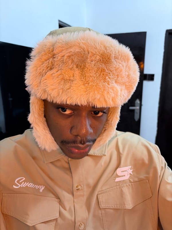 Young man takes selfies in tan Swarvy jacket in Nigeria