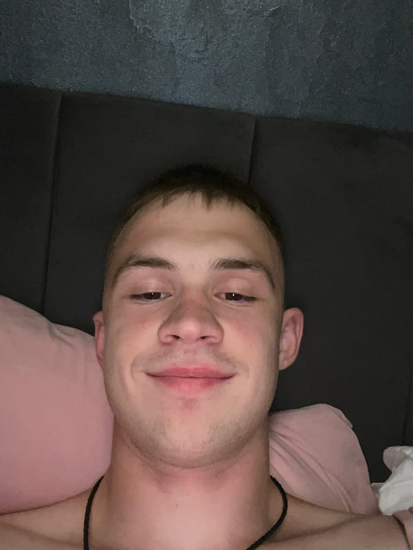 Casual bedroom selfie series on pink pillows