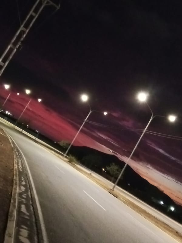 Twilight illuminates curved roadway in Altagracia, Venezuela