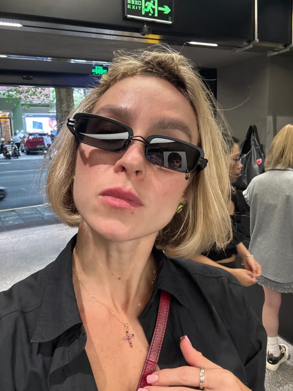Trying on sunglasses at a BLACKHEAD boutique in Shanghai