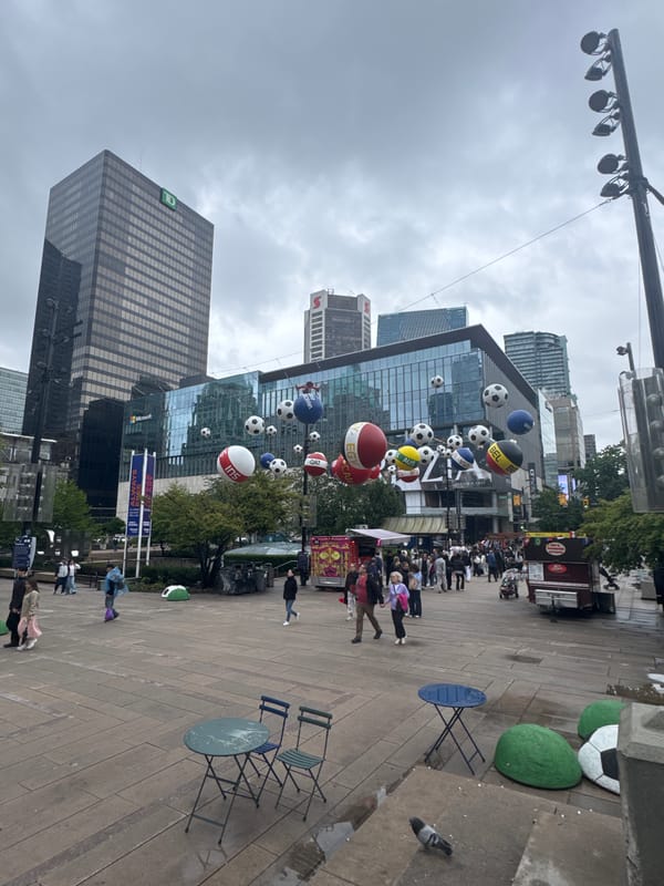 Downtown Vancouver streets and landmarks on a cloudy evening