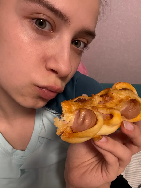 Woman enjoys sausage pastries and fried snacks in Russia