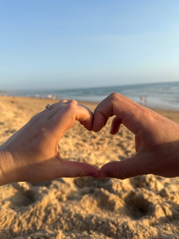 Wedding celebration at Costa da Caparica beach during golden sunset