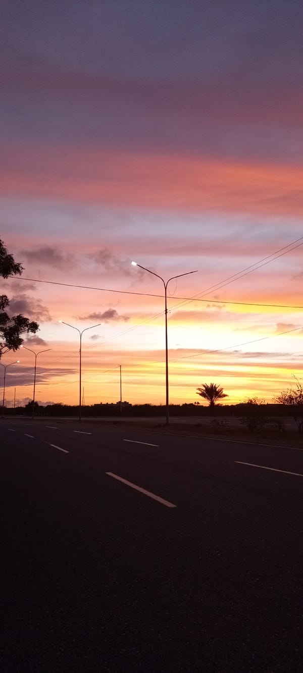 Witnesses document vibrant sunset over roads and neighborhoods April 22