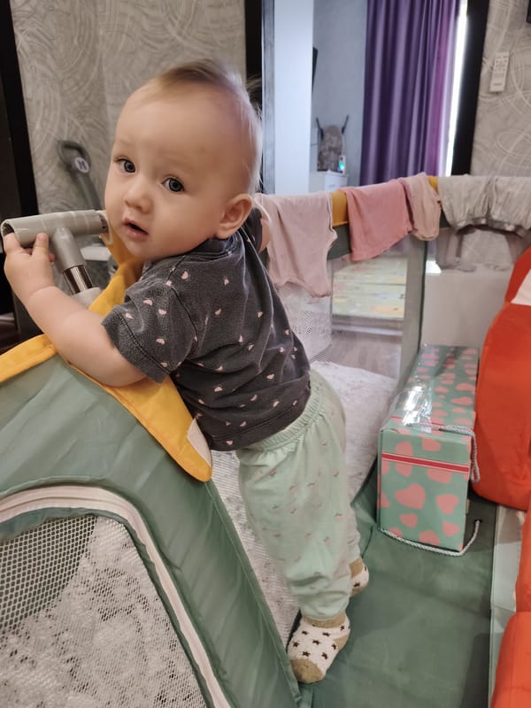 Playtime scenes in Krasnogorskoye playpen and mat setup