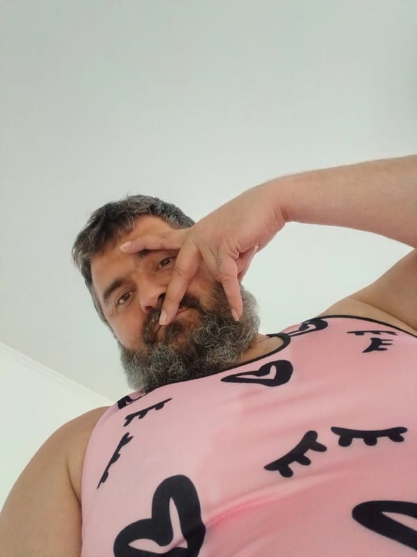 Bearded person poses and gestures for the camera in Pfarrkirchen