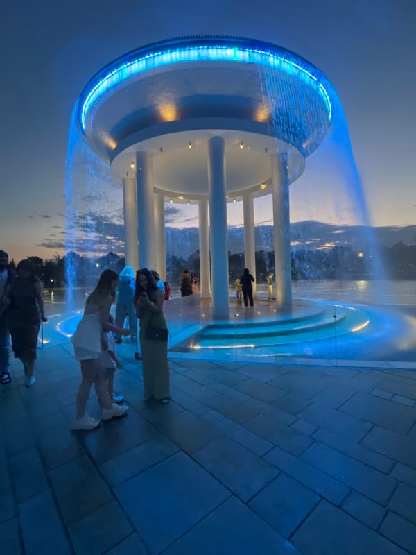 Krasnodar's illuminated fountain complex draws an evening crowd