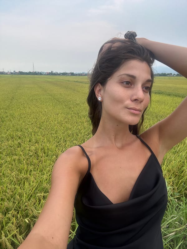 Woman photographs rural rice paddies in Đà Nẵng Vietnam