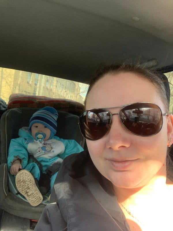 Woman takes car selfie with child in Izhevsk