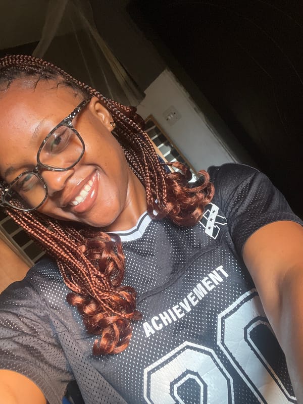 Selfie session in Jos, Nigeria, featuring an 'Achievement 20' jersey
