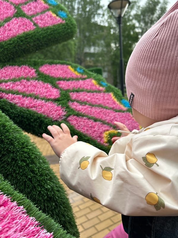 Child visits butterfly globe sculpture park in Chernushka Russia