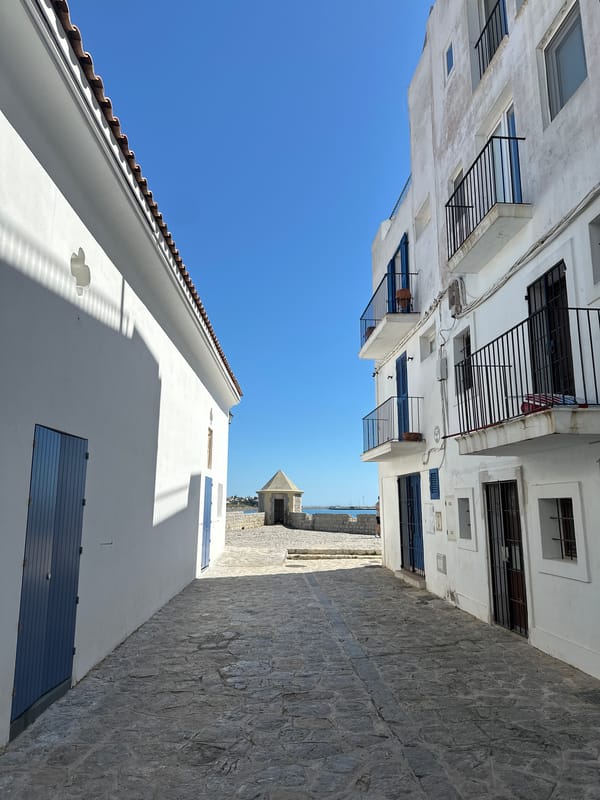 Witness documents Ibiza's white architecture and harbor yacht