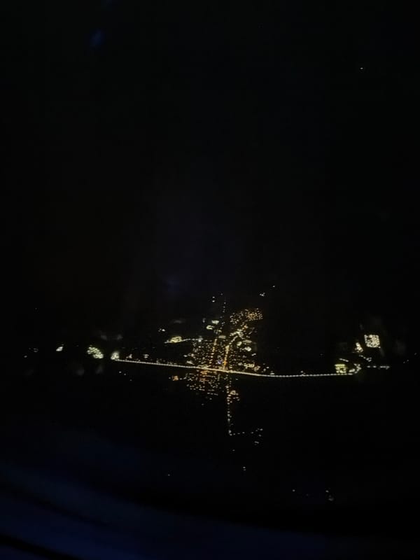 Aerial nighttime view of Lordsburg captured from airplane window