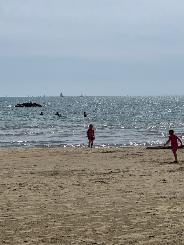 Families enjoy sunny afternoon at Nettuno beach, Italy