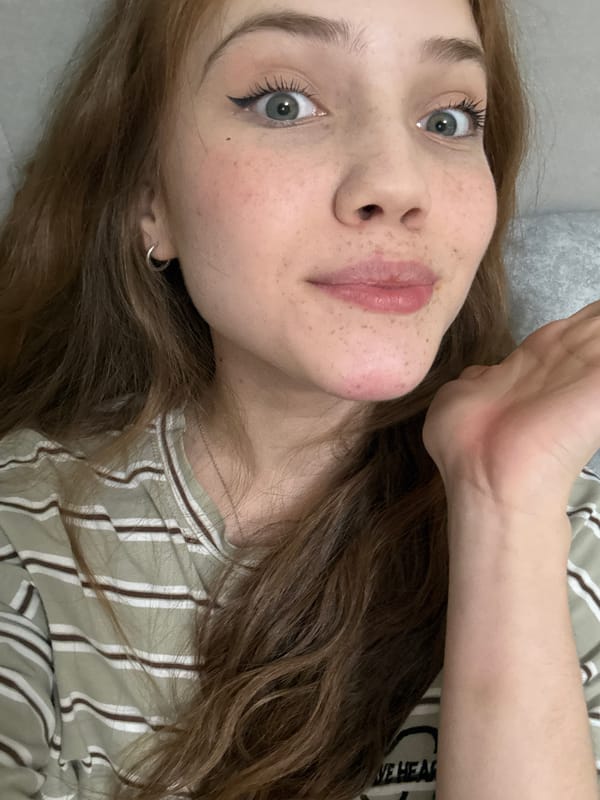 Young woman takes multiple selfies indoors in Naberezhnye Chelny
