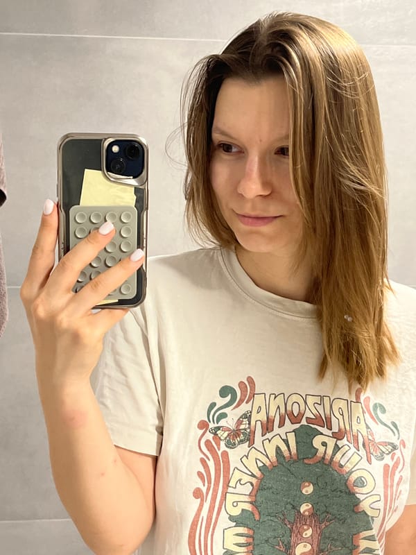 Woman documents evening skincare routine in Limassol bathroom