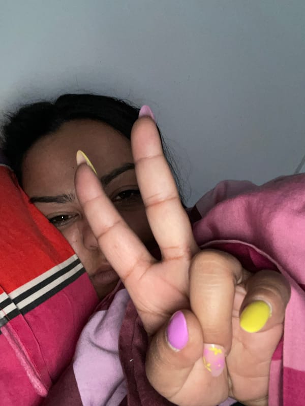 Woman makes peace sign gesture in Dronten