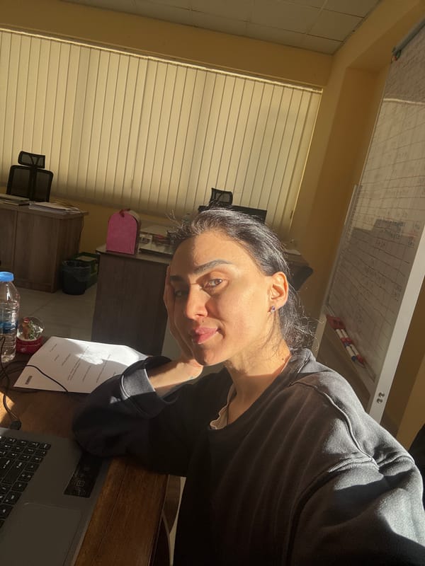 Woman working late night at desk in Tbilisi