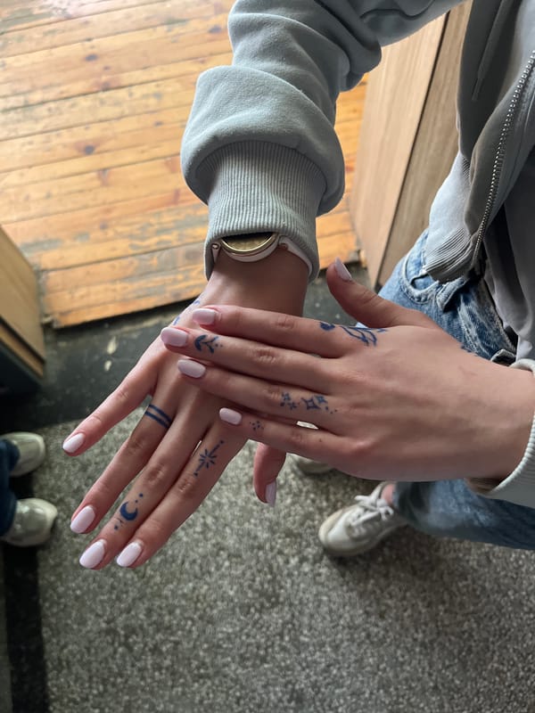 Person documents blue tattoos and pink nails in Ruse