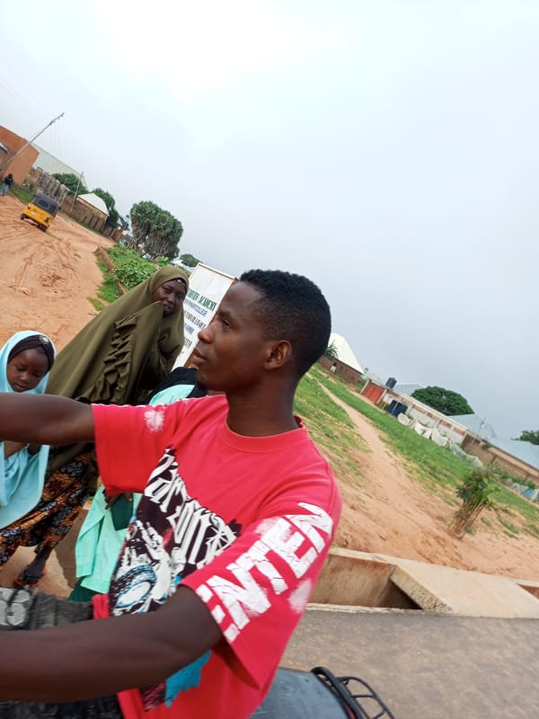 Street gathering on a cloudy morning in Tempure, Nigeria