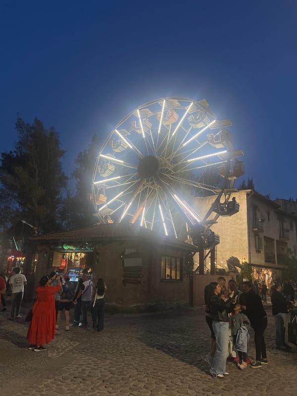 Illuminated carnival rides draw crowds in Domingo Arenas