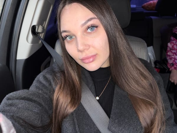 Woman observed in vehicle wearing dark coat in Chaikovsky