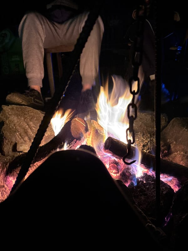 Nighttime campfire burns in enclosed area in Maglic, Serbia