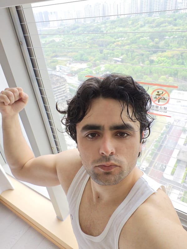 Tourist documents early morning city views from Liangjiang hotel window