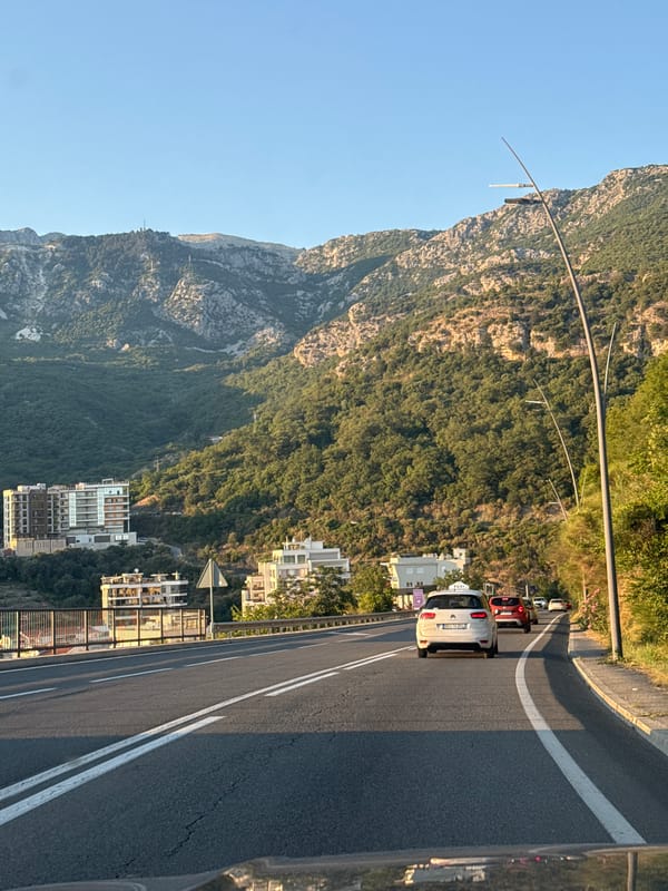 Afternoon traffic on a marked road in Rafailovići, Montenegro