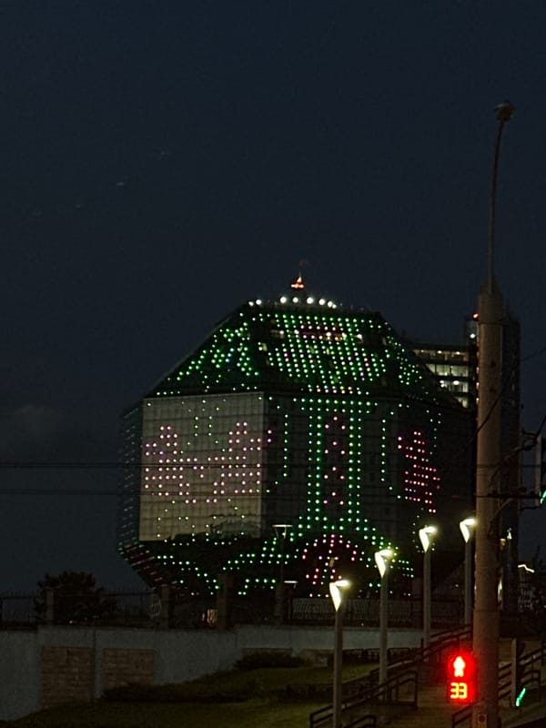 Minsk's illuminated National Library draws evening observers