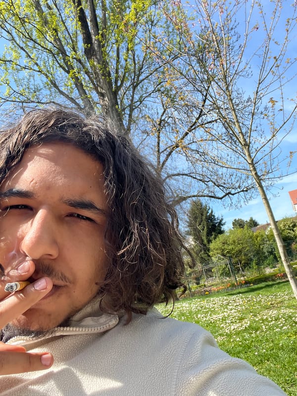 Man relaxes in flower-covered park in Schiltigheim