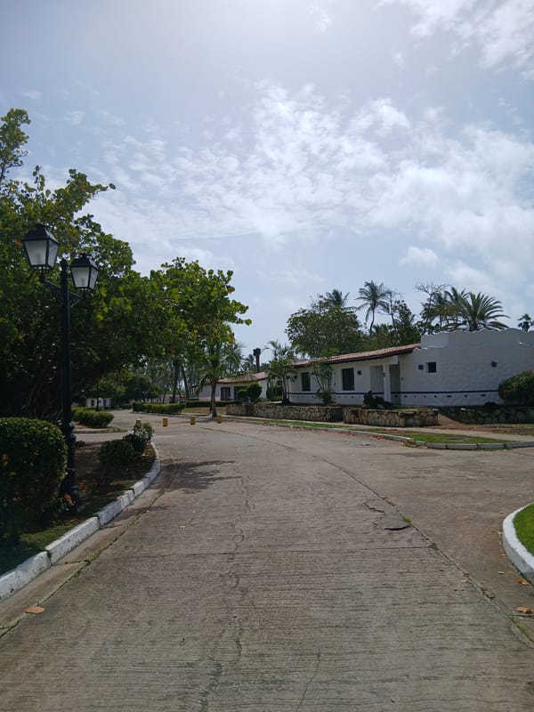 Tourist documents afternoon stroll through Playa El Agua resort grounds