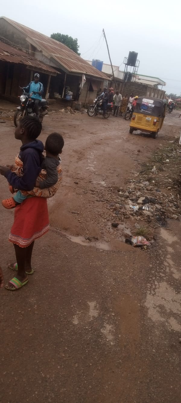 Child carrying scene and meal setting documented simultaneously