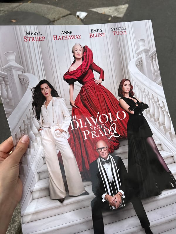Milan street scenes include movie poster, pedestrians captured by witnesses