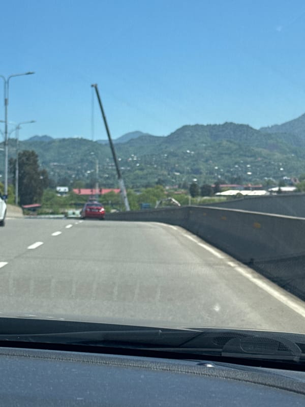 Driver documents curved elevated road in Batumi, Georgia