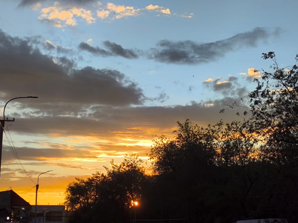 Yerevan sunset sky, clouds lit gold and pink at dusk