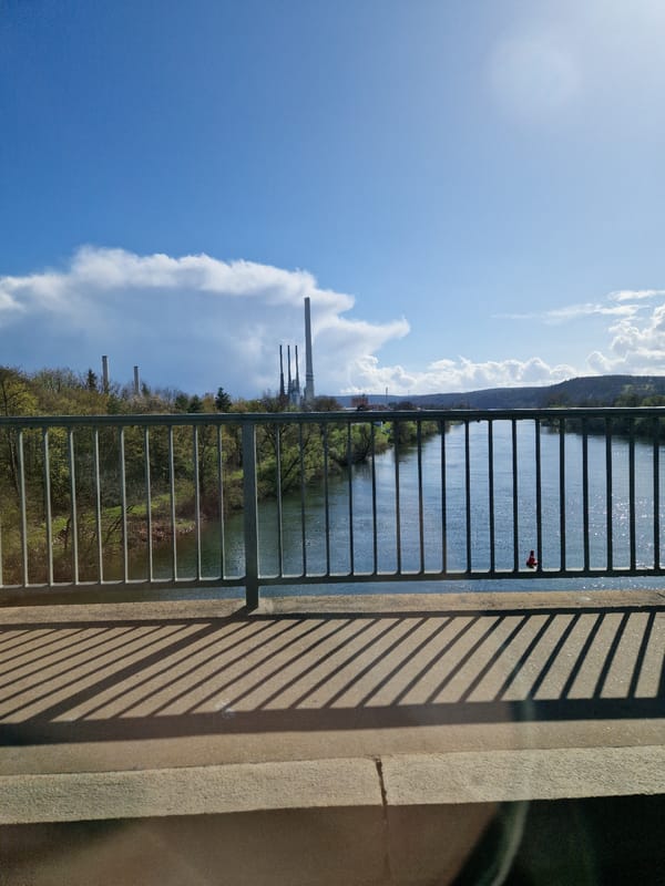 Bridge views captured simultaneously in German Main River towns