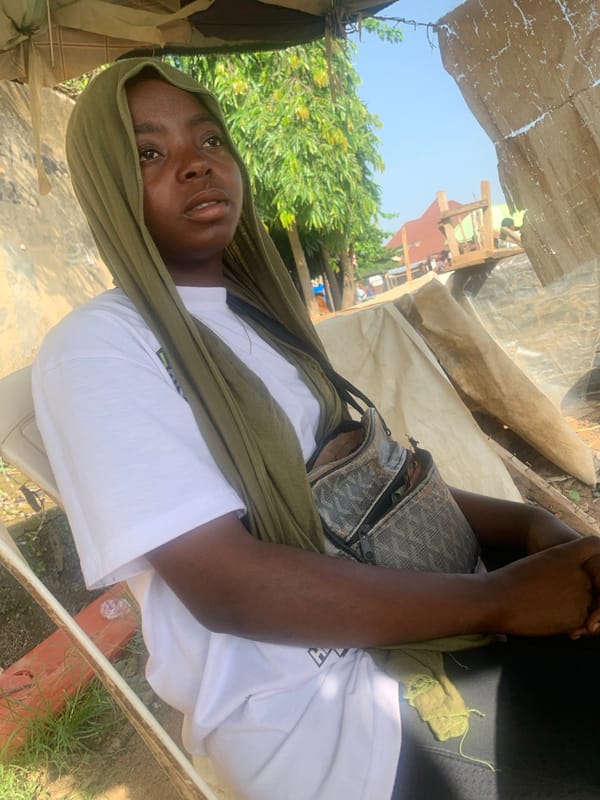 Roadside stop and street activity in Abuja one morning