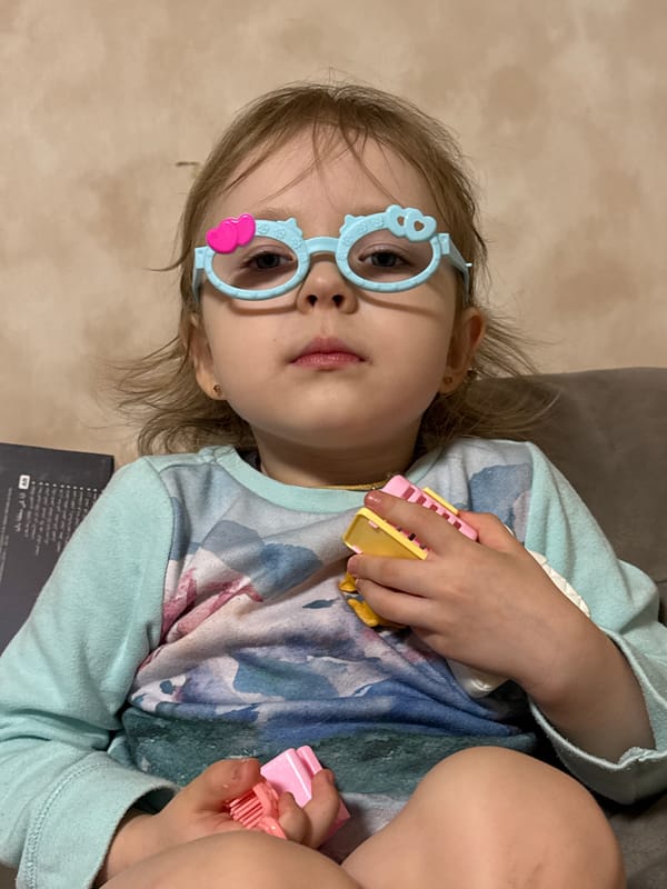 Child's playful moments captured in Russian household