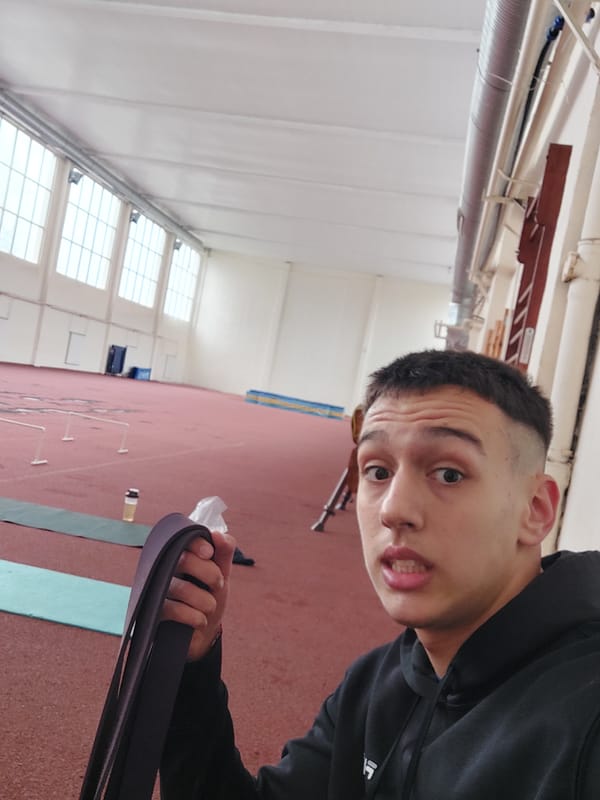 Man exercises with resistance band at Bulgarian athletic facility
