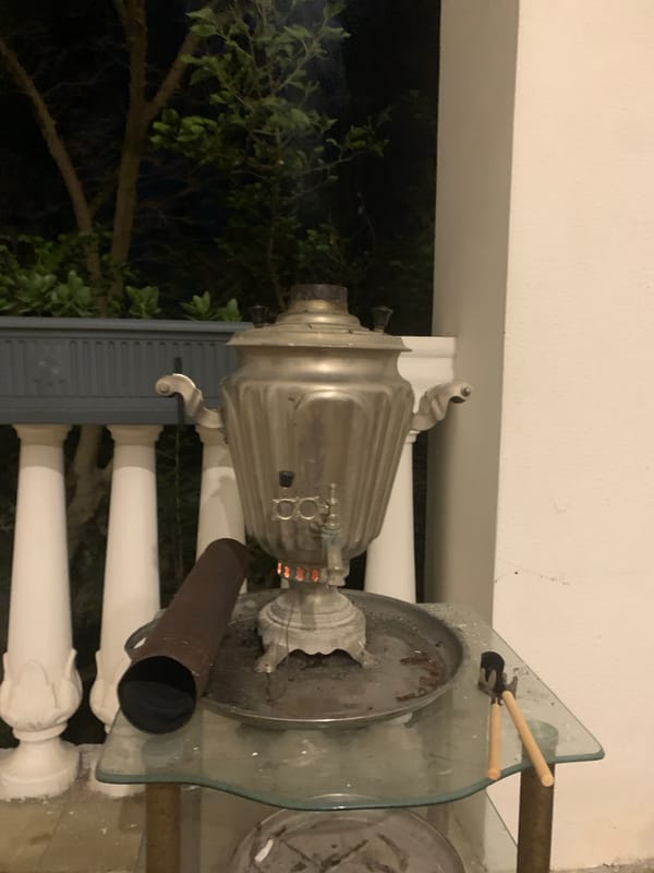Samovar burning on a balcony in Khazar Raion at night