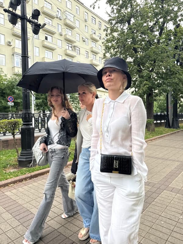 Summer afternoon street life along central Moscow's sidewalks and cafés