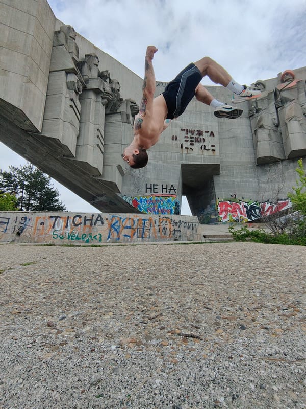 Man performs backflips at Bulgarian-Soviet Friendship Monument in Varna