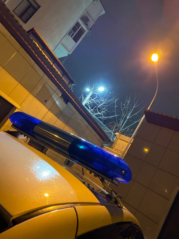 Police vehicles gather at building lot in Sochi