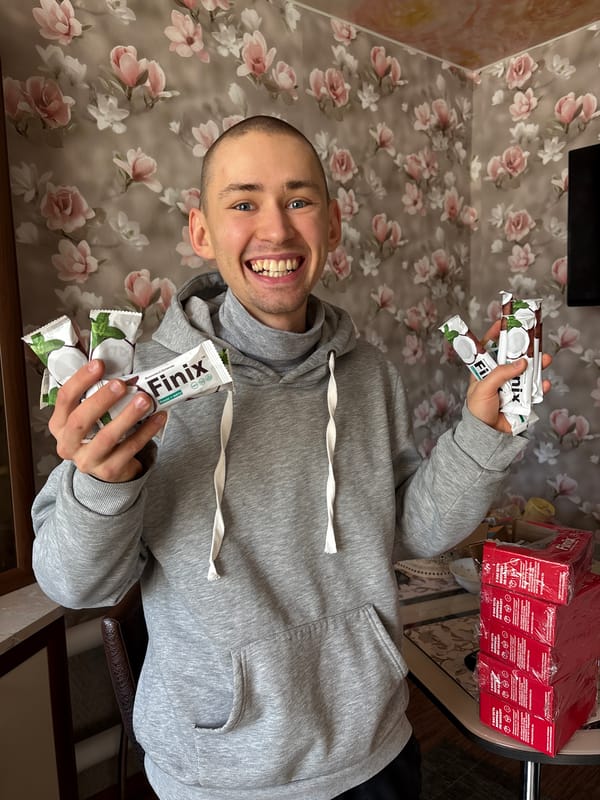 Man displays Finix protein bars in Ulyanovsk home