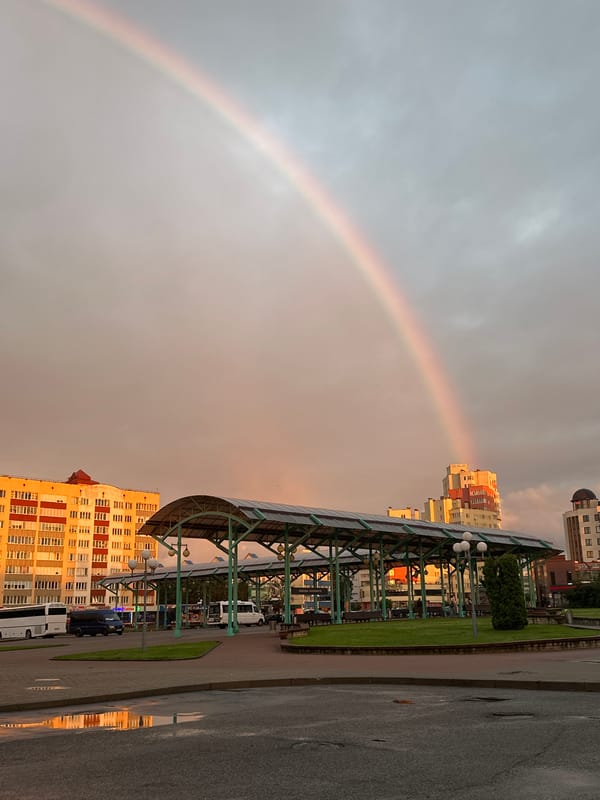 Rainbow over Hrodna at sunset, streaked with pink and orange