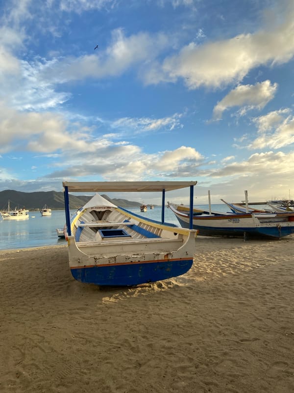 Fishing boats and stormy skies at Juan Griego bay