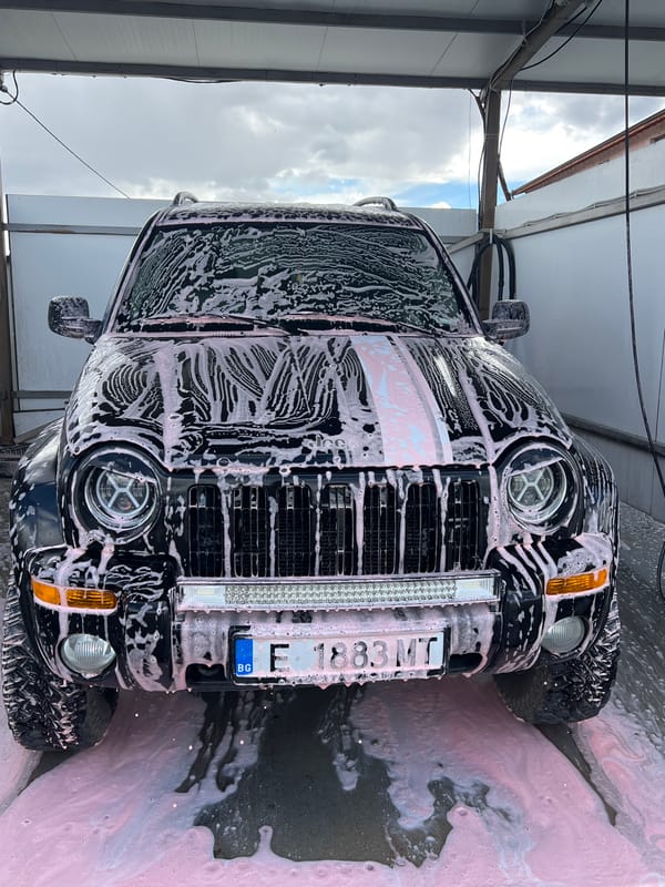 Black SUV gets pink soap wash in Dabnitsa, Bulgaria