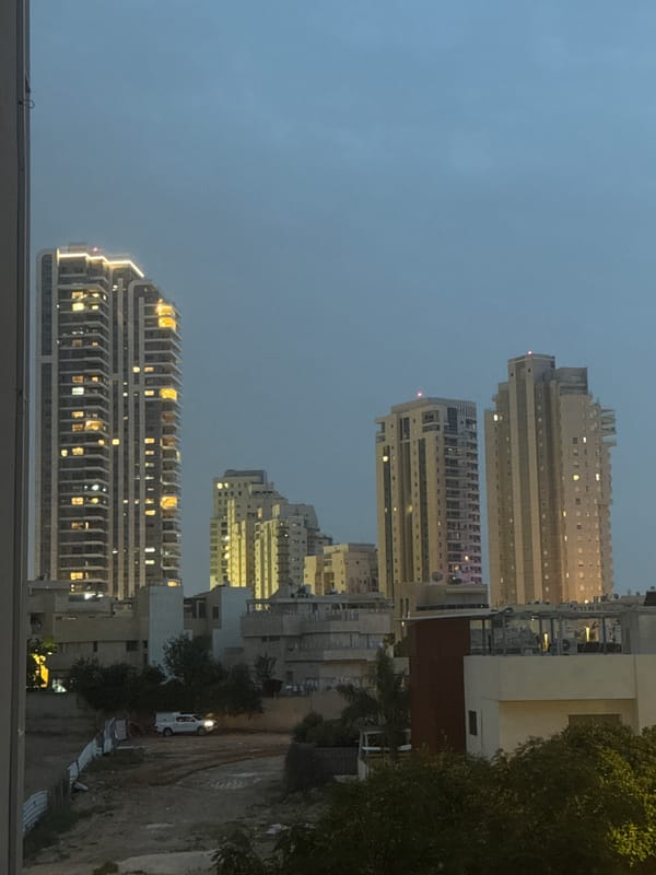 Nighttime cityscape photographed from elevated position in Netanya