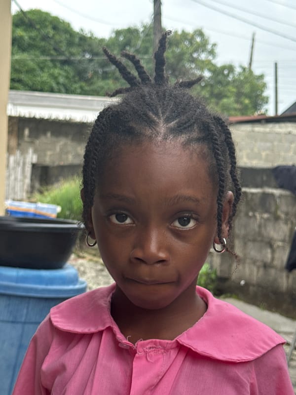 Everyday street life in Ado, Nigeria — vendors, students, transit